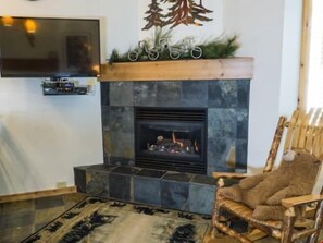 Warm up by the fireplace or entertain at the dining table.