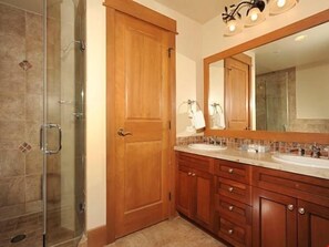 Get ready for the day in the modern and bright bathroom.
