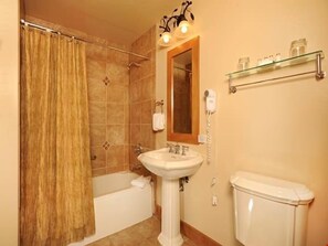 Get ready for the day in the modern and bright bathroom.