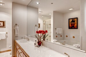 Get ready for the day in the modern and bright bathroom.