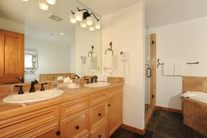Get ready for your day in the pristine bathroom.