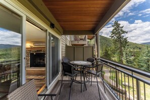 Private balcony offering seating and gorgeous mountain views.