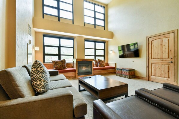 Take a seat in front of the fireplace and enjoy a movie in the living area.
