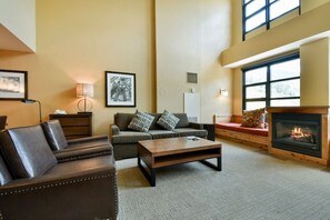 Take a seat in front of the fireplace and enjoy the living area.