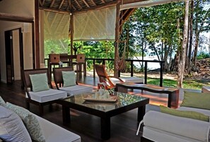 Living room area and bar with ocean view