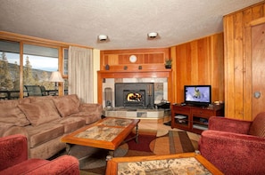 Kick back and relax in the cozy living area. Views will vary.