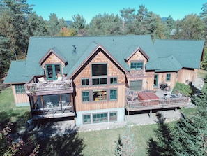 Rear facade:
Covered porch off MB.
Deck off BR w ensuite.
Deck off LR w hot tub.