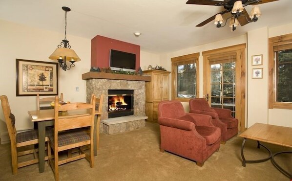 The living area is spacious and cozy, complete with fireplace.