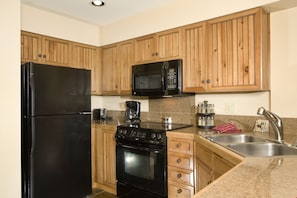 The fully-equipped kitchen has everything you need to cook at home.