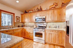 Prepare meals in the full kitchen.