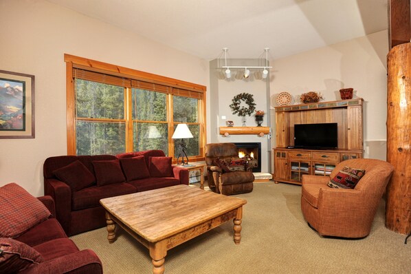 Relax in the cozy living area, complete with fireplace