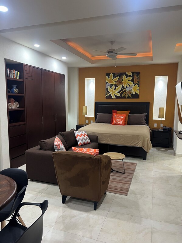 Cozy studio with comfy bed and TV sitting area