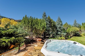 The private hot tub is located in the spacious backyard off of the office space on the middle level of the home.