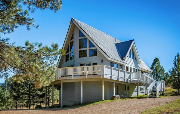 Enjoy the home's wraparound deck and huge wooded yard to make family memories