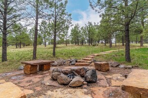 This fantastic fire pit is just steps away from the deck and hot tub.
