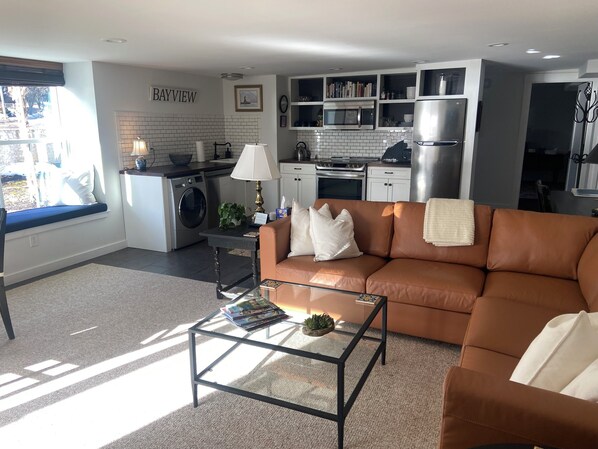 
Great Room with full Kitchen, Dining Table and Living Area with fireplace.