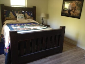 master bedroom with queen bed and Ozark handmade quilt