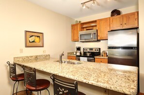 Enjoy cooking in the fully-equipped kitchen, complete with stainless steel appliances