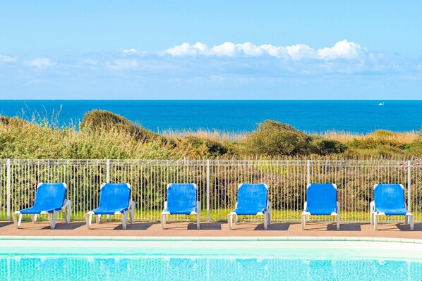 Enjoy seaside views right from the shared swimming pool.