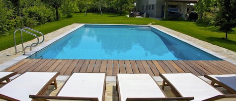 Private pool with villa in background.