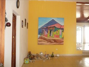 A collection of paintings add beauty to the house.