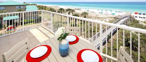 Eat out on the balcony of our ocean front condo at our colorful setting for 4. 