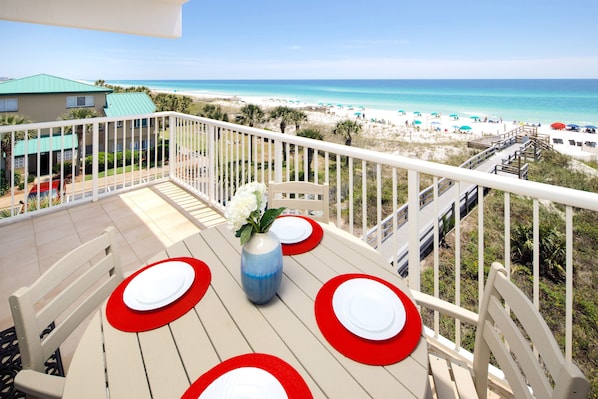Eat out on the balcony of our ocean front condo at our colorful setting for 4. 