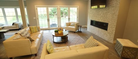 Living room with linear gas fireplace and smart TV