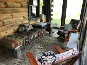 enter onto a screen porch with a water view