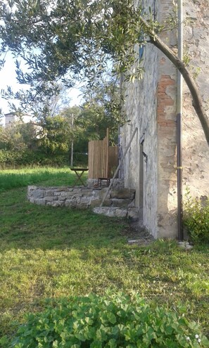 Hot Outdoor Shower with a view and rock-walled morning terrace. 