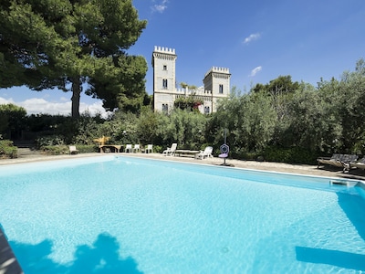 An Art Nouveau-style castle near the sea, with a superb private pool, and surrounded by one and a half hectare park