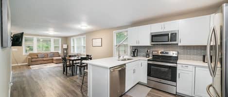 Updated Kitchen with Stainless Steel Appliances and Quartz counter-top