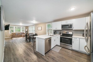 Updated Kitchen with Stainless Steel Appliances and Quartz counter-top