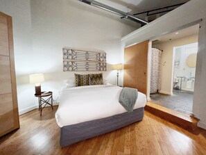 Master bedroom with king bed includes access to the Jack and Jill bathroom with shower stall and laundry room.