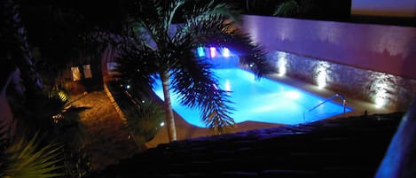 Night view of pool from Master bedroom balcony