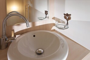 Get ready for the day in the modern and bright bathroom.