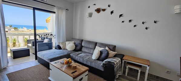 Living room with terrace and ocean view