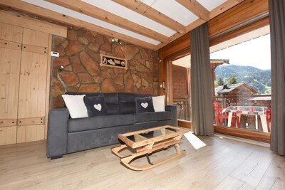 350m from the ski lifts, parking, in the village of La Clusaz