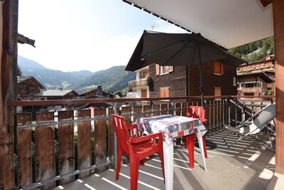 350m from the ski lifts, parking, in the village of La Clusaz