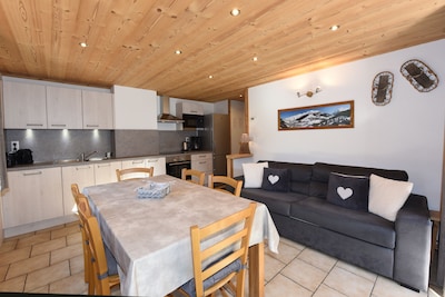 350m from the ski lifts, parking, in the village of La Clusaz