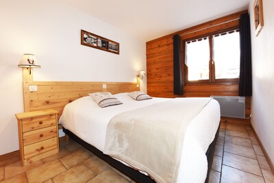 350m from the ski lifts, parking, in the village of La Clusaz