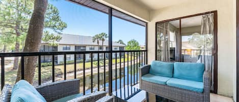 Screened in lanai with views of grounds