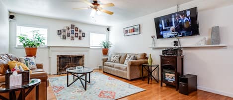 Living room.  Hardwood floors throughout the house.  Bose surround sound.