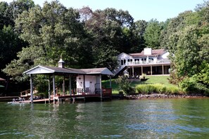 Welcome to Summer Lane! Cabana with fridge, rafts, seating area, boats & dock.