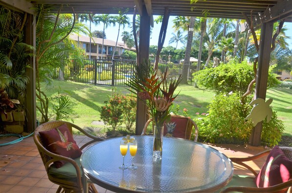 Our relaxing large ground-floor patio overlooking the nearest pool to our condo