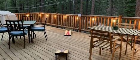 Balcony with patio furniture and string lights