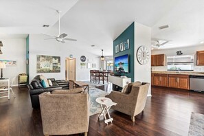 The open concept floor plan includes tall ceilings and great natural light