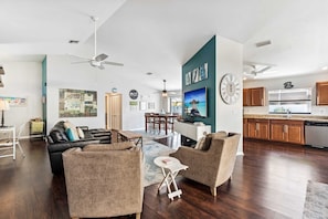 The open concept floor plan includes tall ceilings and great natural light