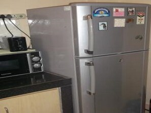 Kitchen- Fridge freezer, toaster and microwave oven