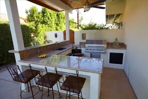 Outdoor kitchen/bar by pool